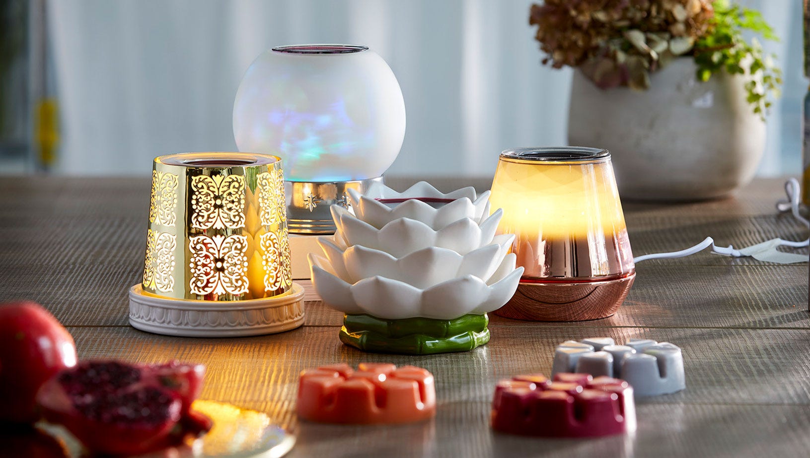 A variety of ScentGlow Warmers on a table