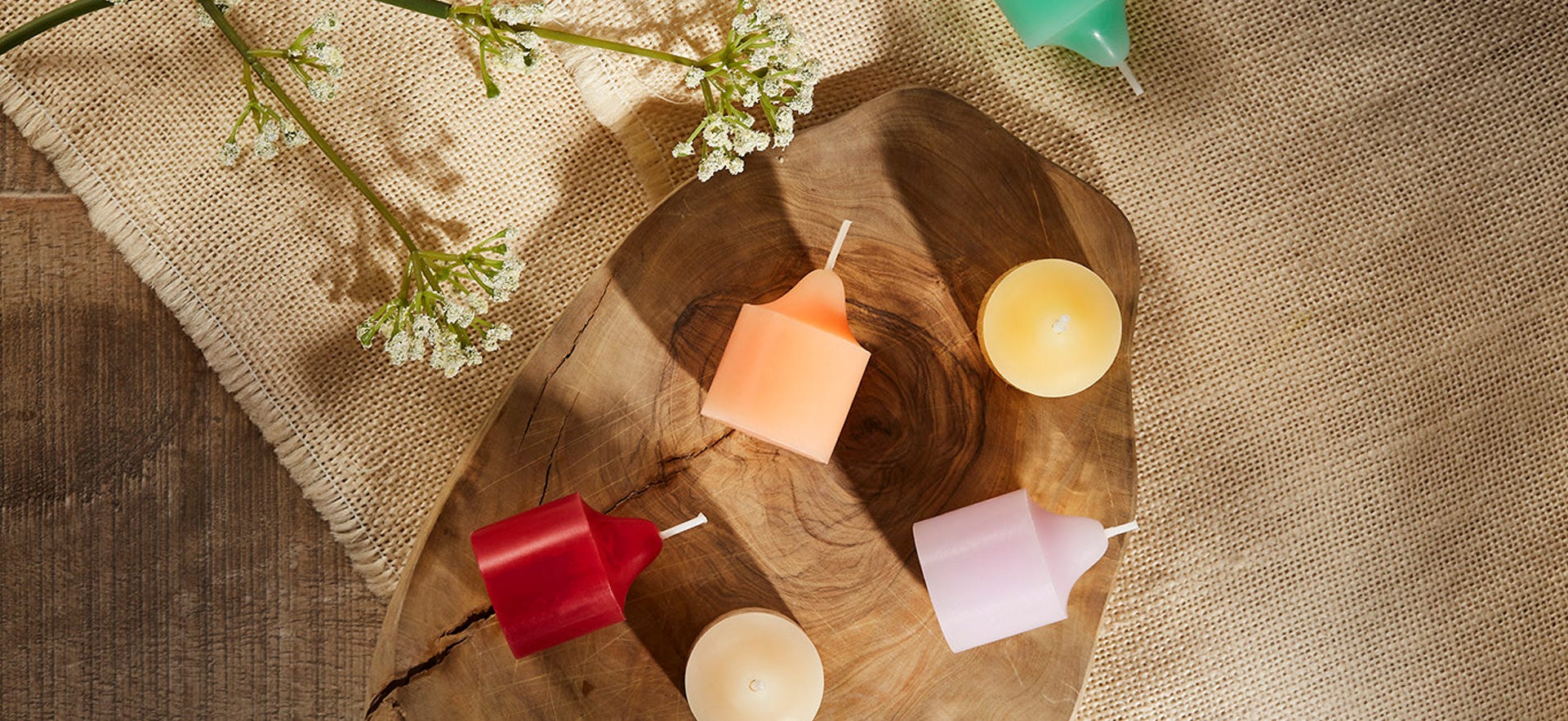 An assortment of votives both standing up and on their side.